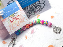 Load image into Gallery viewer, Mother's Day Care Gift, Floral Bead, Bag or Key Charm Gift pack with Heart Charm, with Colouring in card, bath fizzes and other curated goodies