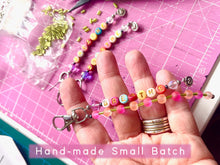 Load image into Gallery viewer, Handbag or key charm accessory with cowrie shell and heart charms and floral summer beachy festival beads, unique gift for her, just breathe