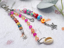 Load image into Gallery viewer, Handbag or key charm accessory with cowrie shell and heart charms and floral summer beachy festival beads, unique gift for her, just breathe