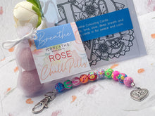 Load image into Gallery viewer, Mother&#39;s Day Care Gift, Floral Bead, Bag or Key Charm Gift pack with Heart Charm,  with Colouring in card, bath fizzes and other curated goodies
