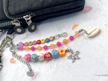 Load image into Gallery viewer, Handbag or key charm accessory with cowrie shell and heart charms and floral summer beachy festival beads, unique gift for her, just breathe

