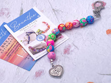 Load image into Gallery viewer, Mother&#39;s Day Care Gift, Floral Bead, Bag or Key Charm Gift pack with Heart Charm,  with Colouring in card, bath fizzes and other curated goodies
