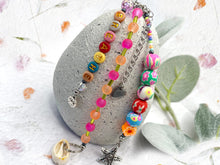 Load image into Gallery viewer, Handbag or key charm accessory with cowrie shell and heart charms and floral summer beachy festival beads, unique gift for her, just breathe
