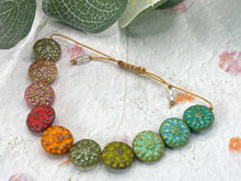 Load image into Gallery viewer, Close-up of handmade Czech glass dahlia beads on mindfulness bracelet
