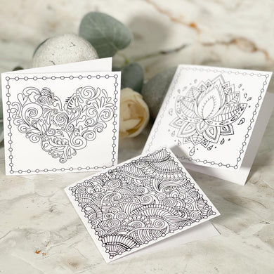 Three little cards, each with a different mandal design, for you to colour in at home. Comes with envelopes and little sealing stickers.  Cards are on 110gm white card.  The envelopes are white too.  
You will get a pack of 3 cards, ALL different designs.  They are 90x90mm and are on 110gms white card.  They are blank on the inside so that you can write your own message.  They will be UN COLOURED!