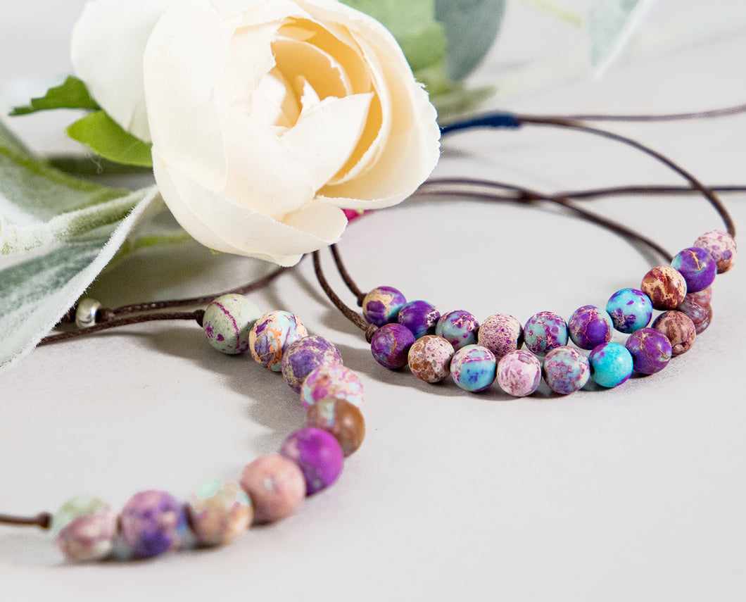 The most beautiful, unique stones.  Pinks, purple, turquoise and lilacs marble they weay through these stones.  10 Stones on a cotton cord to help you to keep count of your breaths during your 10 breaths practice.